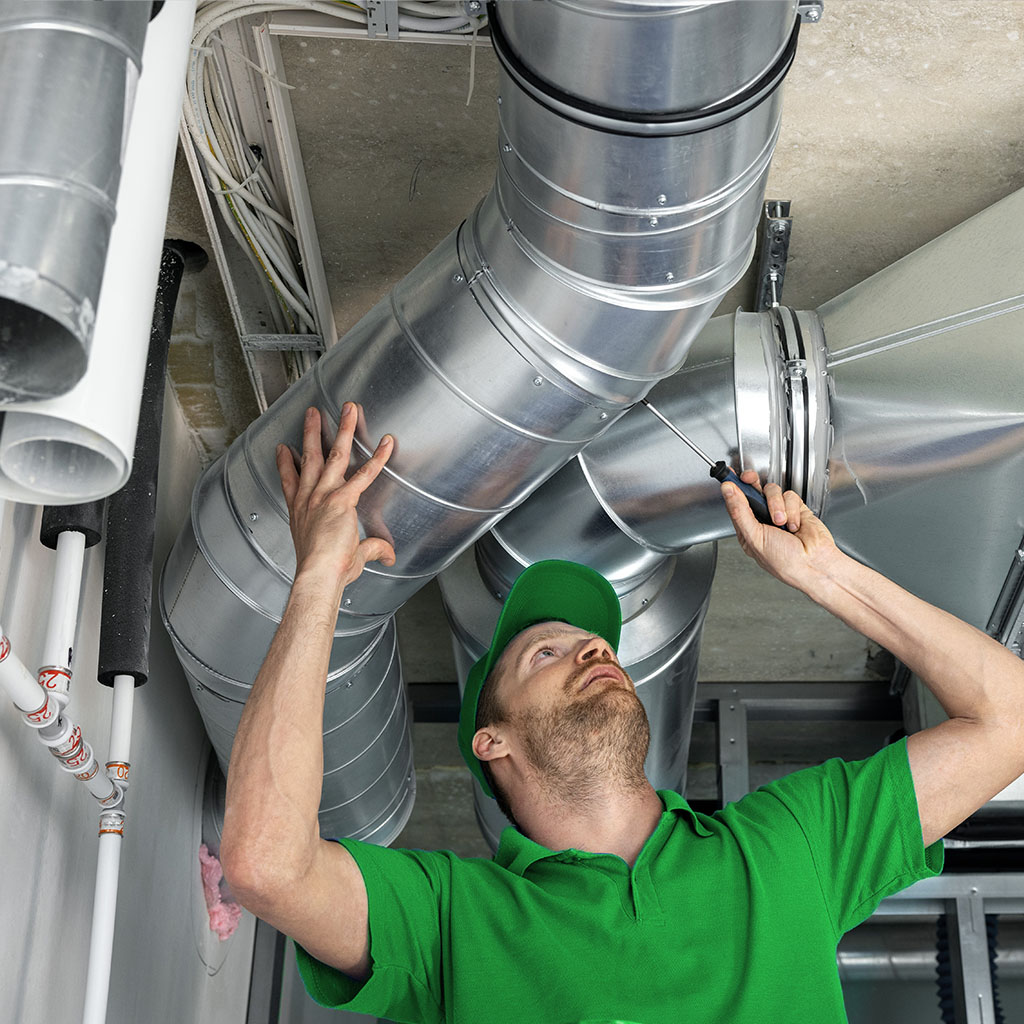 A Quantech technician installing an air conditioning unit